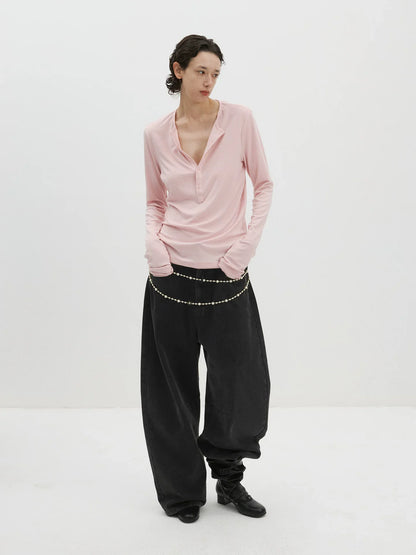 DISTRESSED CURVED-BLADE JEANS