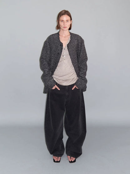 DISTRESSED CURVED-BLADE JEANS