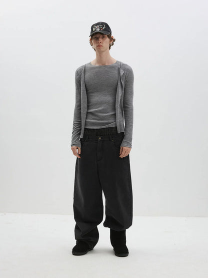 DISTRESSED CURVED-BLADE JEANS